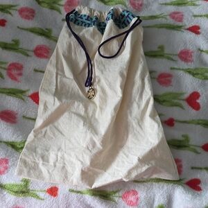 Tory Burch Cream Canvas Drawstring Pouch with Navy Cord and Gold Charm